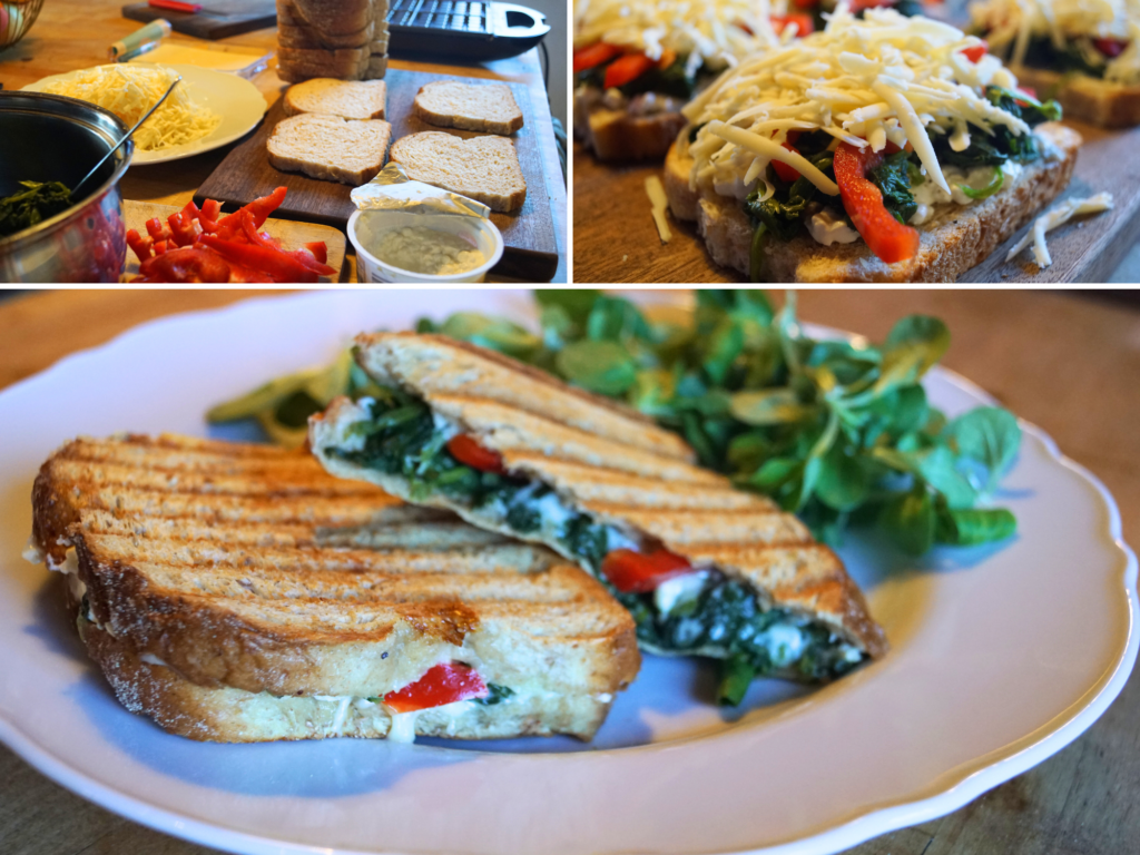 gegrilltes Spinat-Toast mit Käse, Paprika und Hüttenkäse auf dem Teller