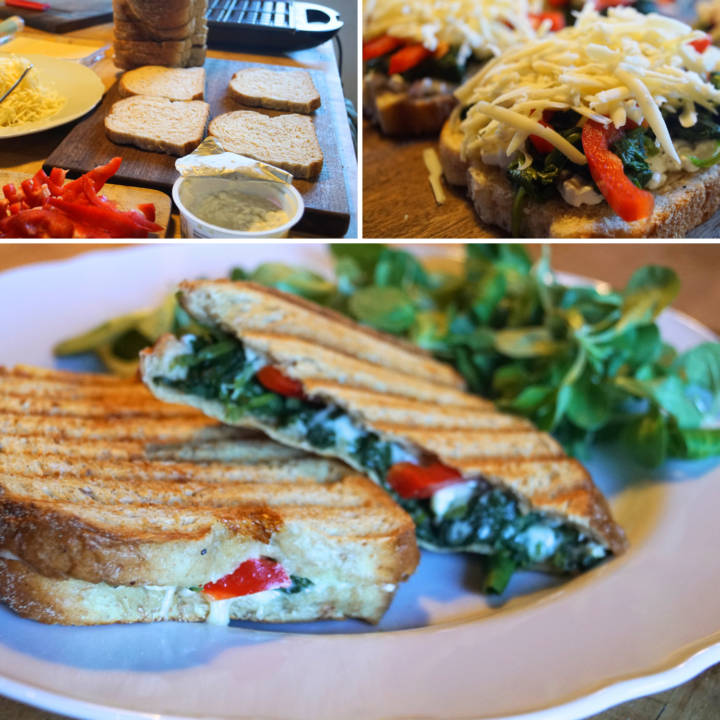 gegrilltes Spinat-Toast mit Käse, Paprika und Hüttenkäse auf dem Teller